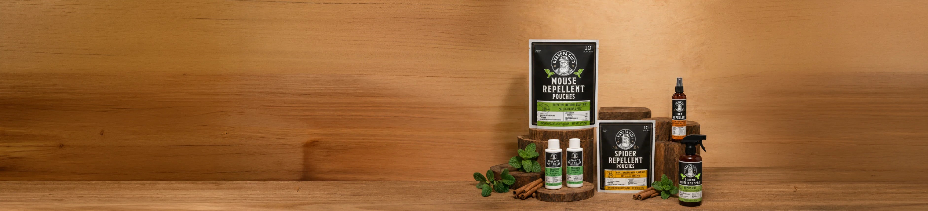 A group of Grandpa Gus products arranged on a wooden surface against a wooden background.